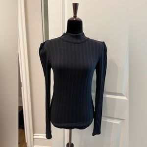 Black open-back sweater with tie scarf